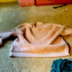 This is a woman’s medium fluffy jacket